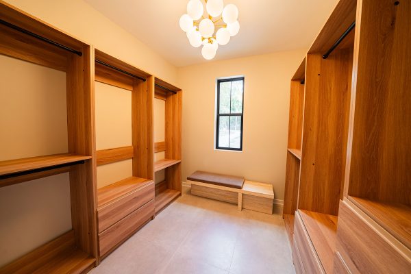 Woodhaven custom home Circleville Ohio walk-in closet with custom wood cabinetry